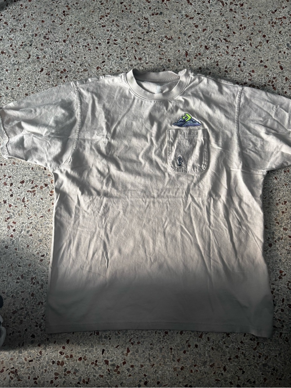 The selected region features the Converse Novelty Cloud Pocket Tee. Medium